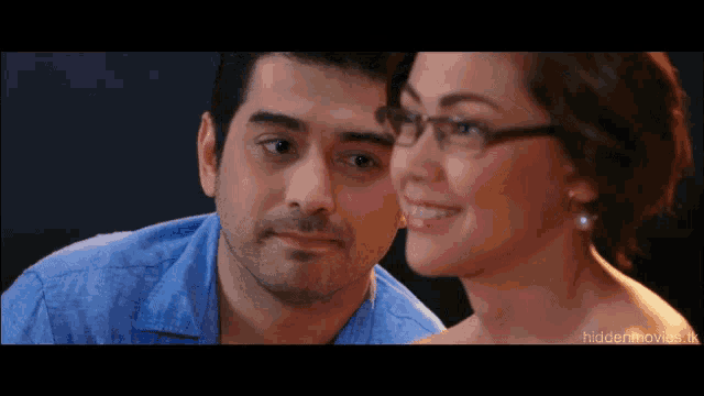 a man and a woman are looking at each other with the words hidden movie in the lower right corner