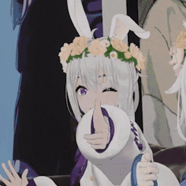 a girl with bunny ears and a flower crown on her head