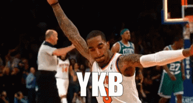 a basketball player with the word ykb written on his jersey