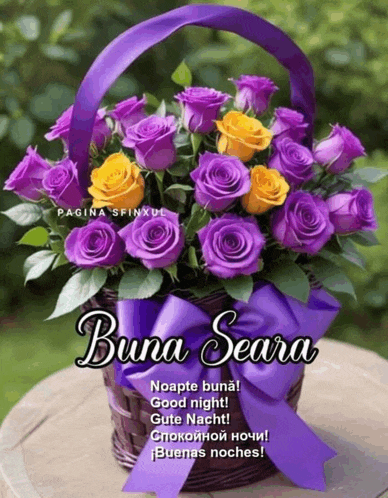 purple and yellow roses in a basket with the words buna seara on the bottom