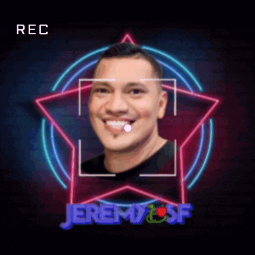 a man is smiling in front of a neon star with the name jeremy on it