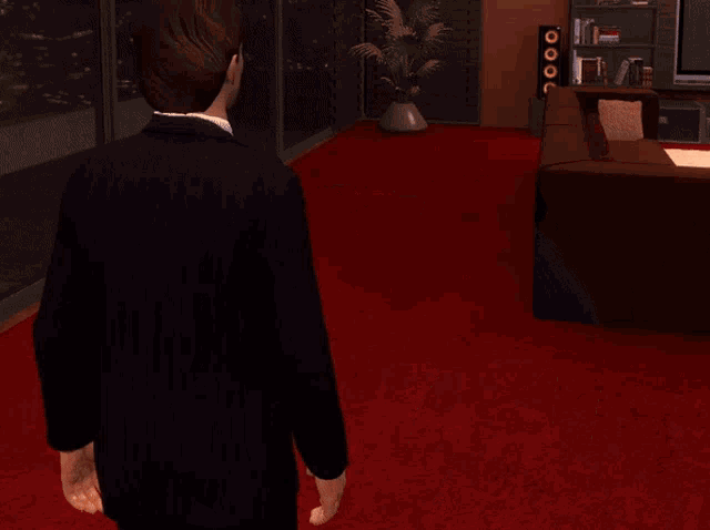 a man in a suit and tie stands in a room