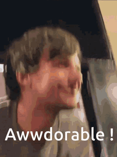 a blurry picture of a man with the words awwdorable written on the bottom