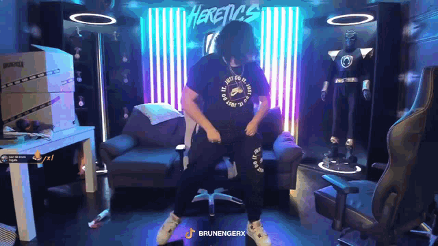 a man wearing a nike shirt is dancing in a room