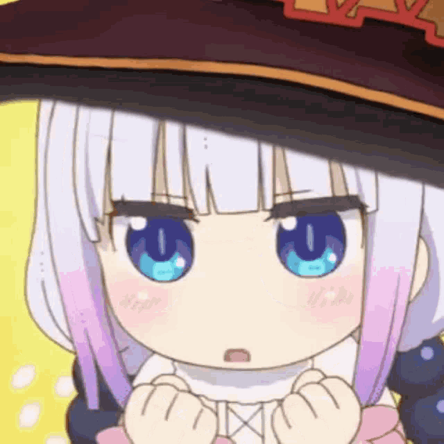 a close up of a cartoon girl wearing a witch hat and holding her hands together .