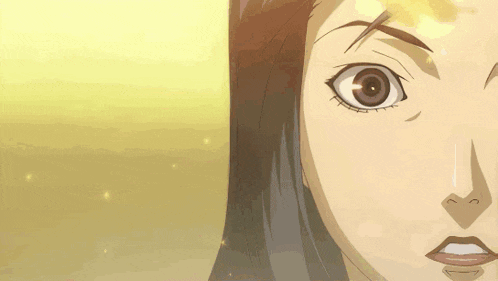 a close up of a woman 's face with large eyes