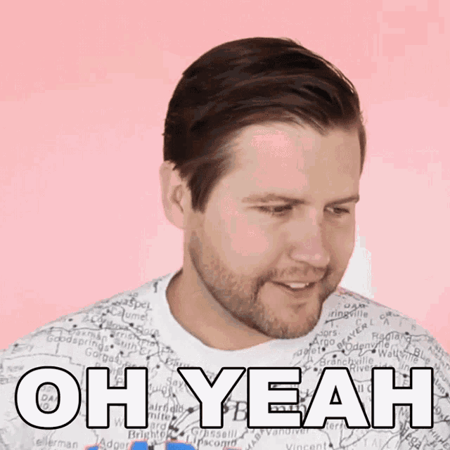 a man with a beard is wearing a shirt that says oh yeah on it