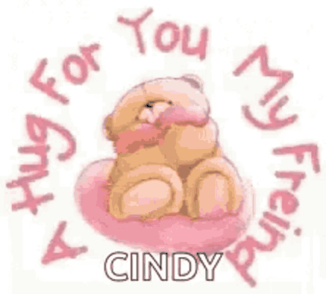 a teddy bear is sitting on a pink pillow hugging another teddy bear on a pink pillow .