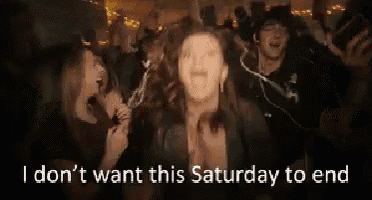 a woman is dancing in a crowd of people with the words `` i don t want this saturday to end '' written below her .
