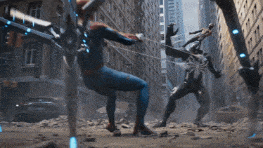 a man in a spiderman suit is fighting a giant spider