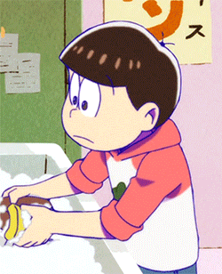 a boy is washing his hands in front of a sign that says ' s ' on it