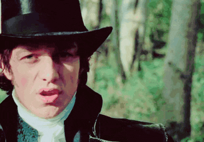 a man wearing a top hat and a suit is making a funny face