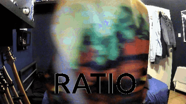 a blurred image of a person with the word ratio written in black