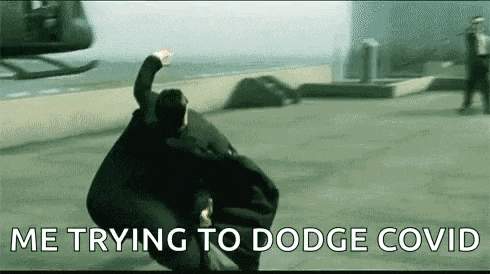 a man in a cape is flying through the air in front of a helicopter .
