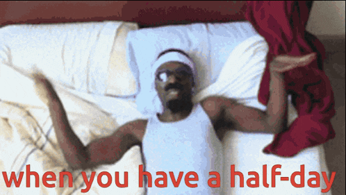 a man laying on a bed with the words " when you have a half-day "