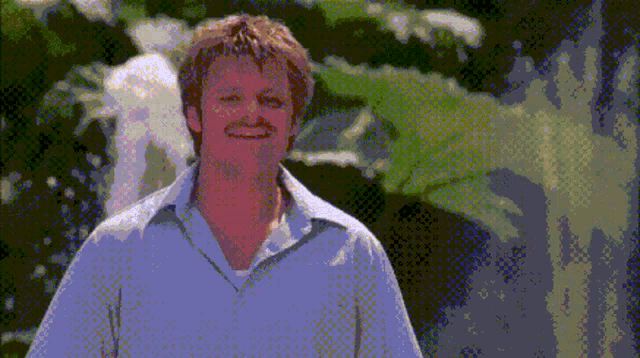 a pixelated image of a man in a white shirt