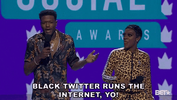 a man and a woman on a stage with the words black twitter runs the internet