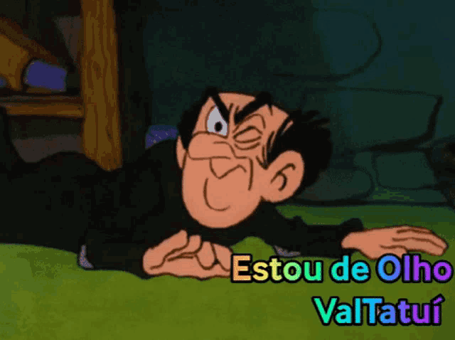 a cartoon character laying on the ground with the words " estou de olho " written below him