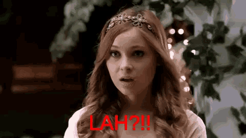 a woman wearing a headband with the word lah written in red