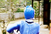 a person in a blue costume with a blue helmet on their head
