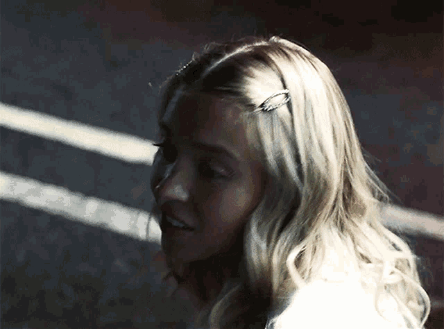 a close up of a woman 's head with a hair clip in her hair