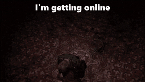 a person is kneeling down in a dark room with the words " i 'm getting online " on the bottom