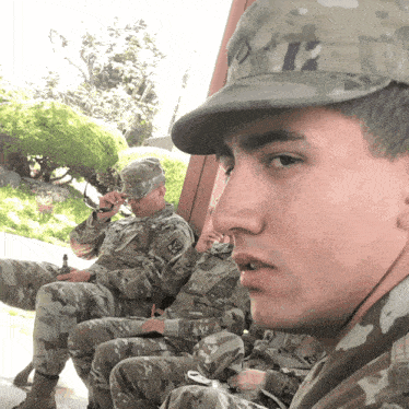 a man in a military uniform with the number 23 on it