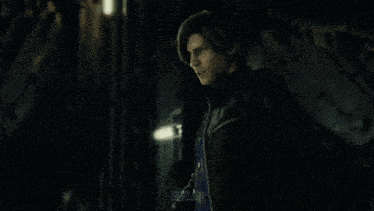a man in a dark room with the name leon on the bottom left