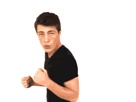 a man in a black shirt is making a surprised face