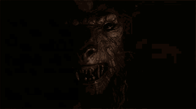 a close up of a werewolf 's face with sharp teeth and a beard
