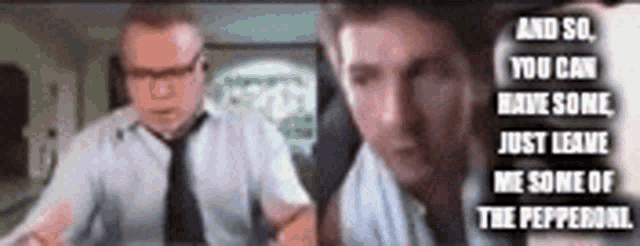 a man in a tie is talking to another man in a suit