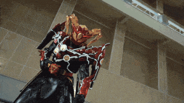 a robot with a helmet that looks like a dragon is standing in front of a wall