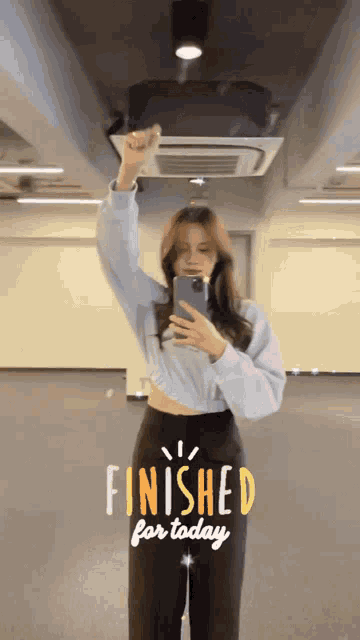 a woman taking a picture of herself with the words finished for today