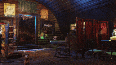 a cat sits in a room with a vault boy poster on the wall above it