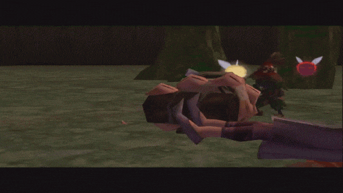a video game character is laying on the ground while another character stands behind him