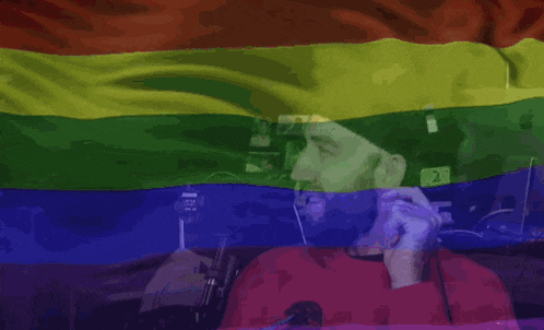 a rainbow flag with a sign that says gh3