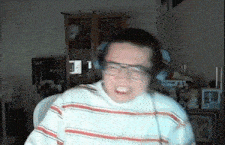a man wearing headphones and glasses is making a face