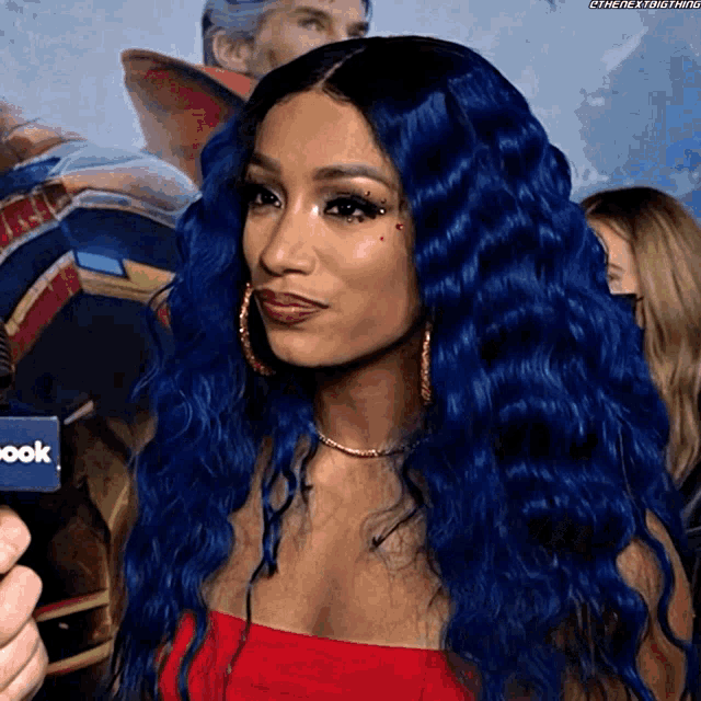 a woman with blue hair is standing in front of a sign that says " book "