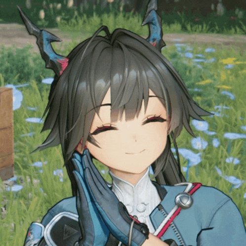 a girl with horns on her head is smiling with her eyes closed