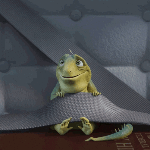 a lizard is sitting on top of a book that says federal law