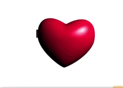 a heart shaped mirror with a picture of a woman in it