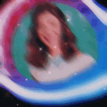 a woman 's face is visible in a painting with a rainbow background