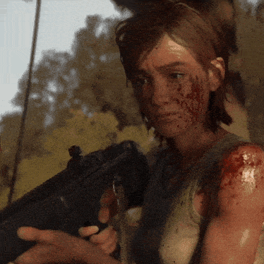a woman holding a gun with blood on her face