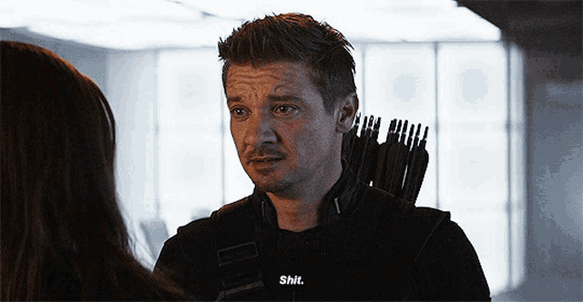 a man with a bow and arrow is talking to a woman and says " shit "