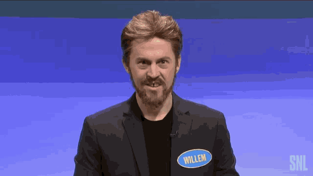 a man in a suit with a name tag that says willem
