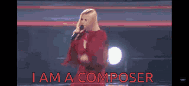 a woman singing into a microphone with the words " i am a composer " above her