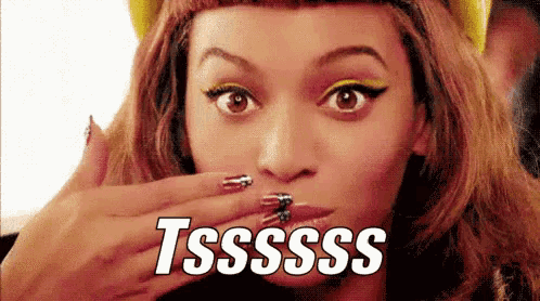 a close up of a woman covering her mouth with her hand and the words tsssss on the bottom
