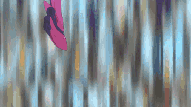 a blurred image of a person 's feet in a pink shoe