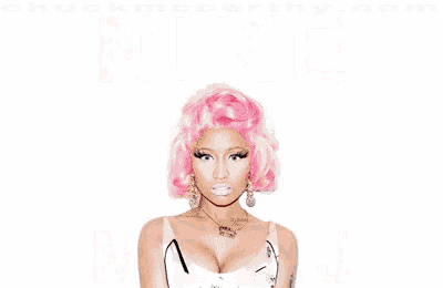 a woman with pink hair stands in front of a pair of pink nike shoes