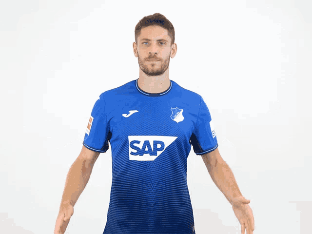 a man in a blue shirt that says sap on it
